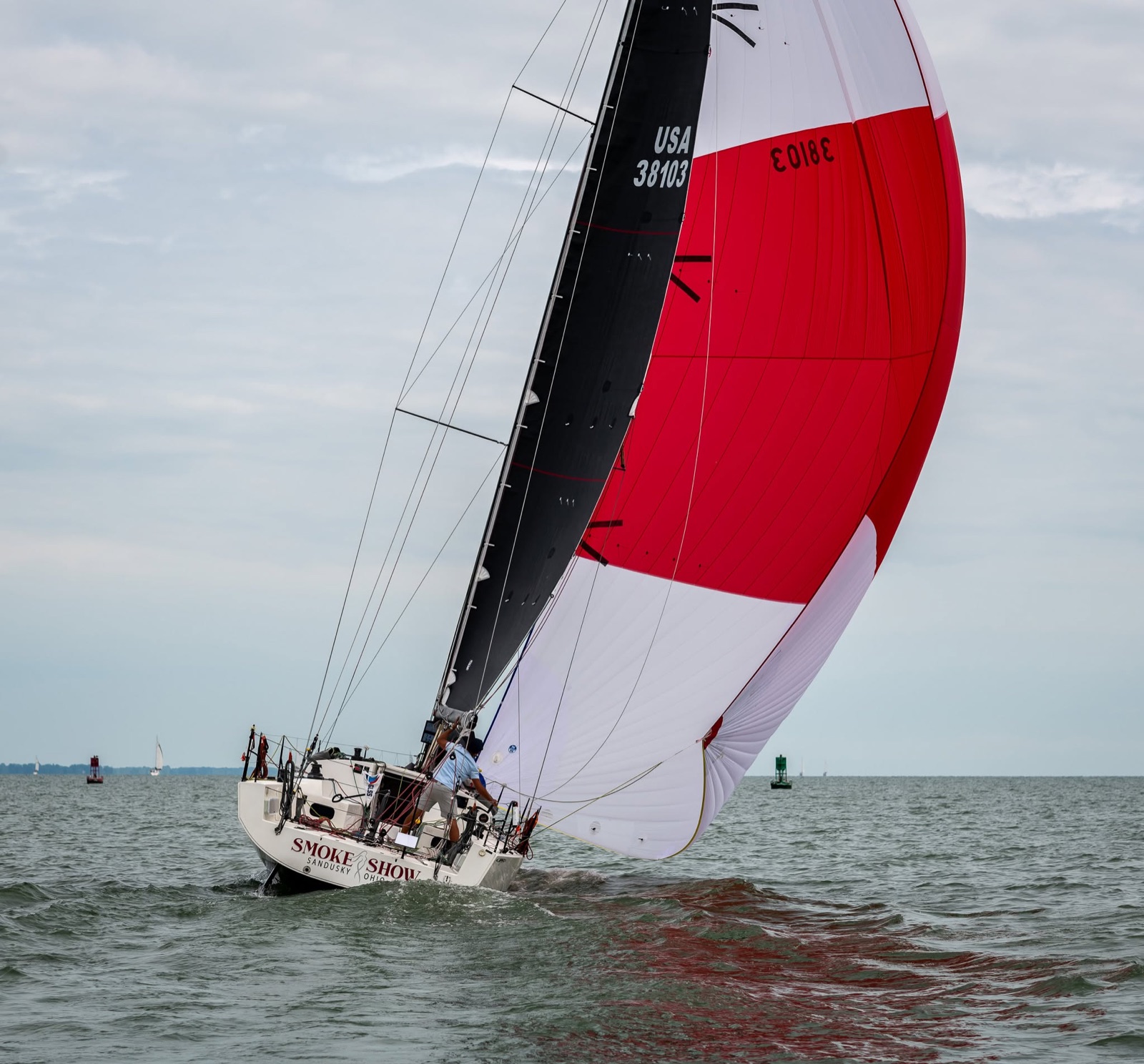 Smoke Show racing under a red and white spinnaker on Lake Erie